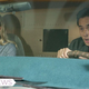 Addison and Ben looking shocked while driving a getaway vehicle.